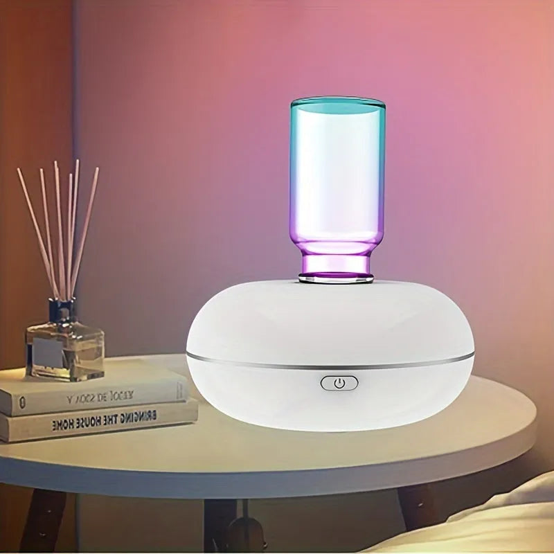 Automatic sensor fragrance machine mini USB home indoor air diffuser inverted aromatherapy in white colour on bathroom counter.