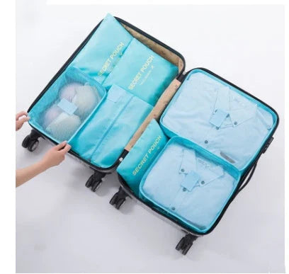 Durable waterproof packing cubes in various colors for organized, efficient travel