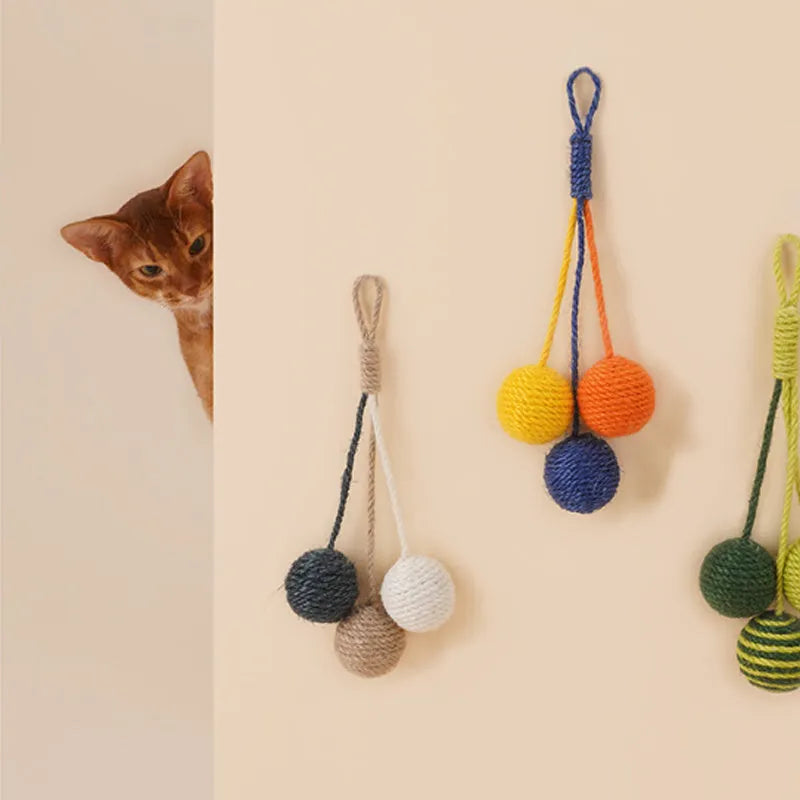 Bite-resistant cat teaser wand set with colourful attachments and catnip ball on a blue background