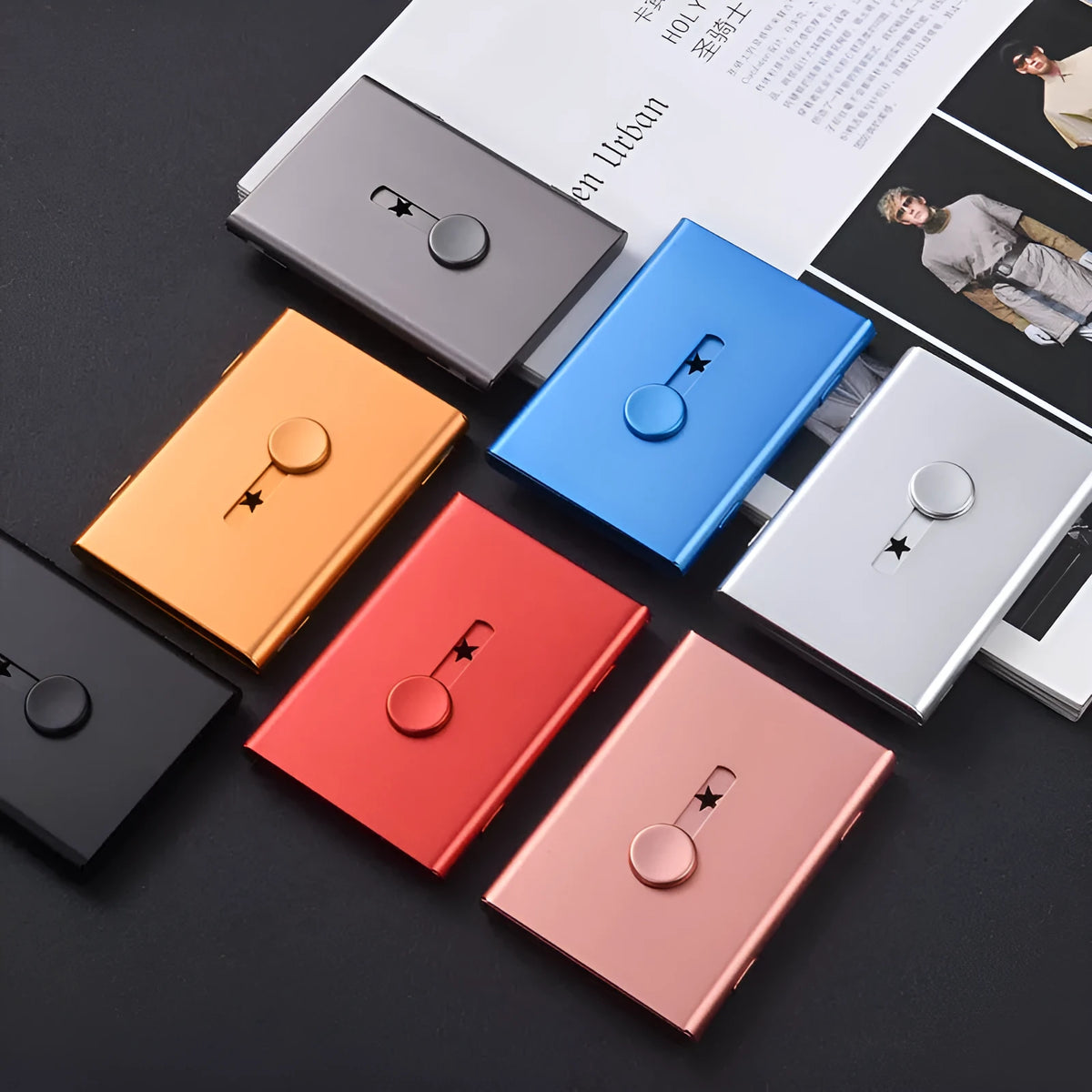 Hand push aluminium business card case in silver shown open with cards and internal layers visible