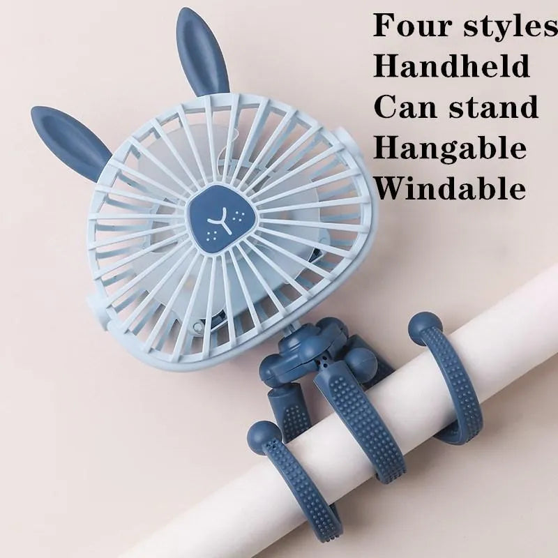 Cute animal design mini stroller fan with LED night light and flexible clip in pink on a stroller