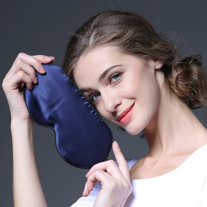 Double-sided mulberry silk eye mask in one of 21 colours, showing embroidered detail and measuring 22x11cm.