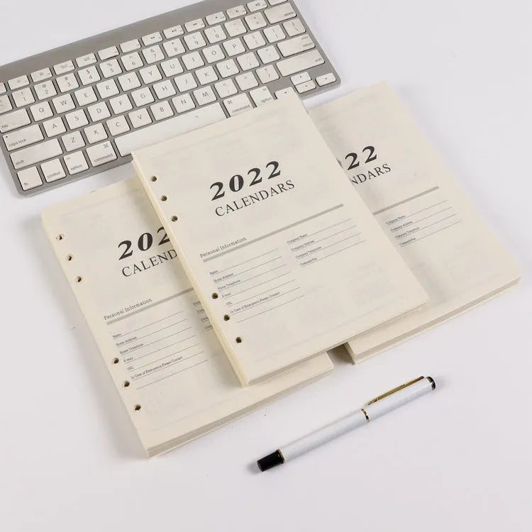 White A5 loose-leaf notebook inner pages with monthly plan layout on paper