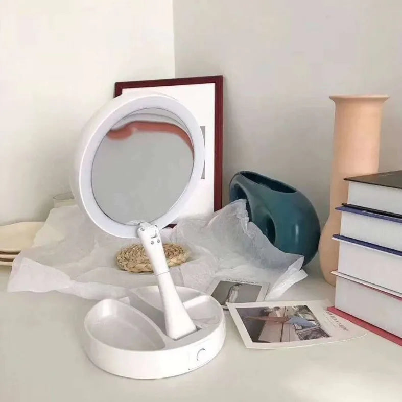 White acrylic LED vanity mirror with double-sided magnification and foldable storage compartments.