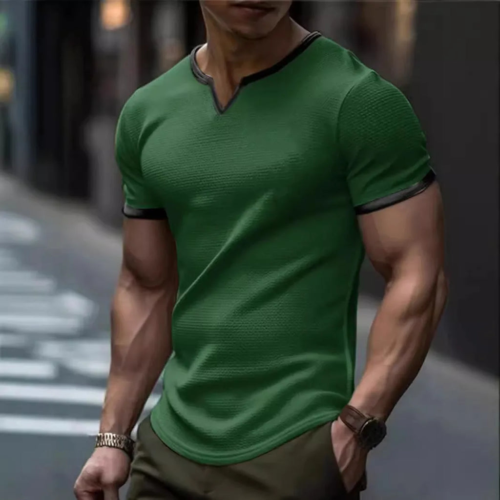 Colour-block V-neck sports t-shirt in waffle-knit polyester fabric on a hanger.