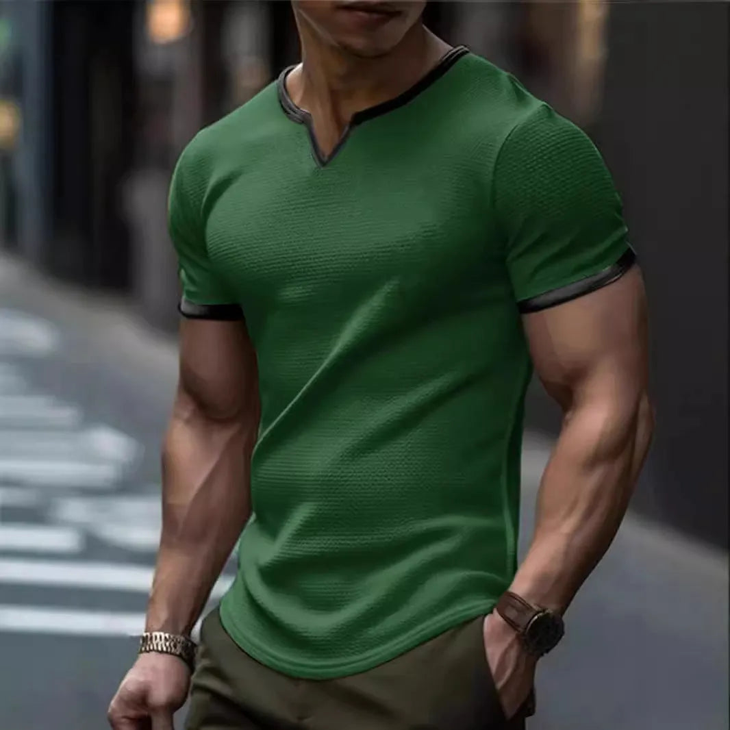 Colour-block V-neck sports t-shirt in waffle-knit polyester fabric on a hanger.