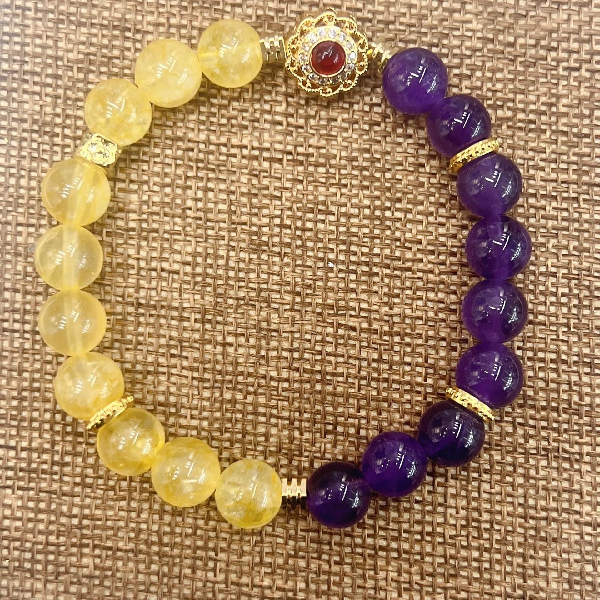 Handmade women's crystal bracelet with amethyst stones in yellow and purple colours