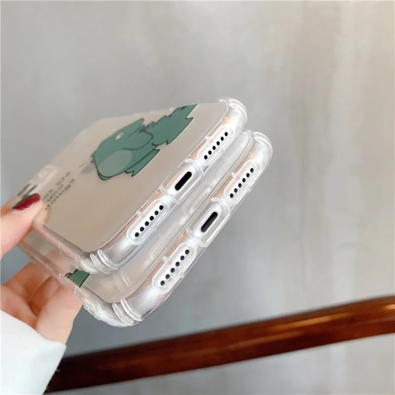 Transparent silicone TPU iPhone case with airbag design and a green dinosaur graphic on the back.
