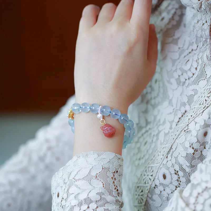 DIY aquamarine bracelet kit with Chinese Fengjiu fox design and pink crystals.