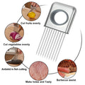 Stainless steel onion holder with sharp prongs and a finger guard on a kitchen counter.