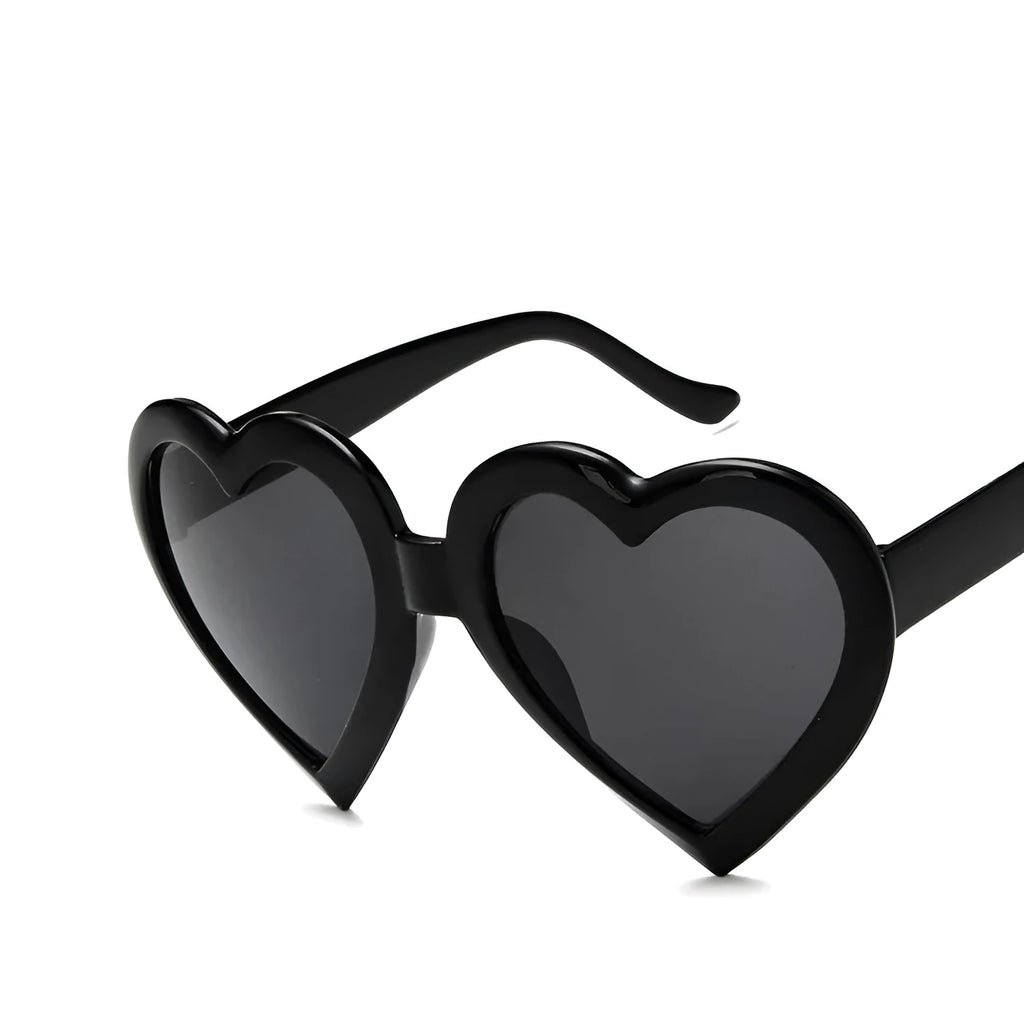 Children's heart-shaped sunglasses with bright red resin lenses and full rim frame
