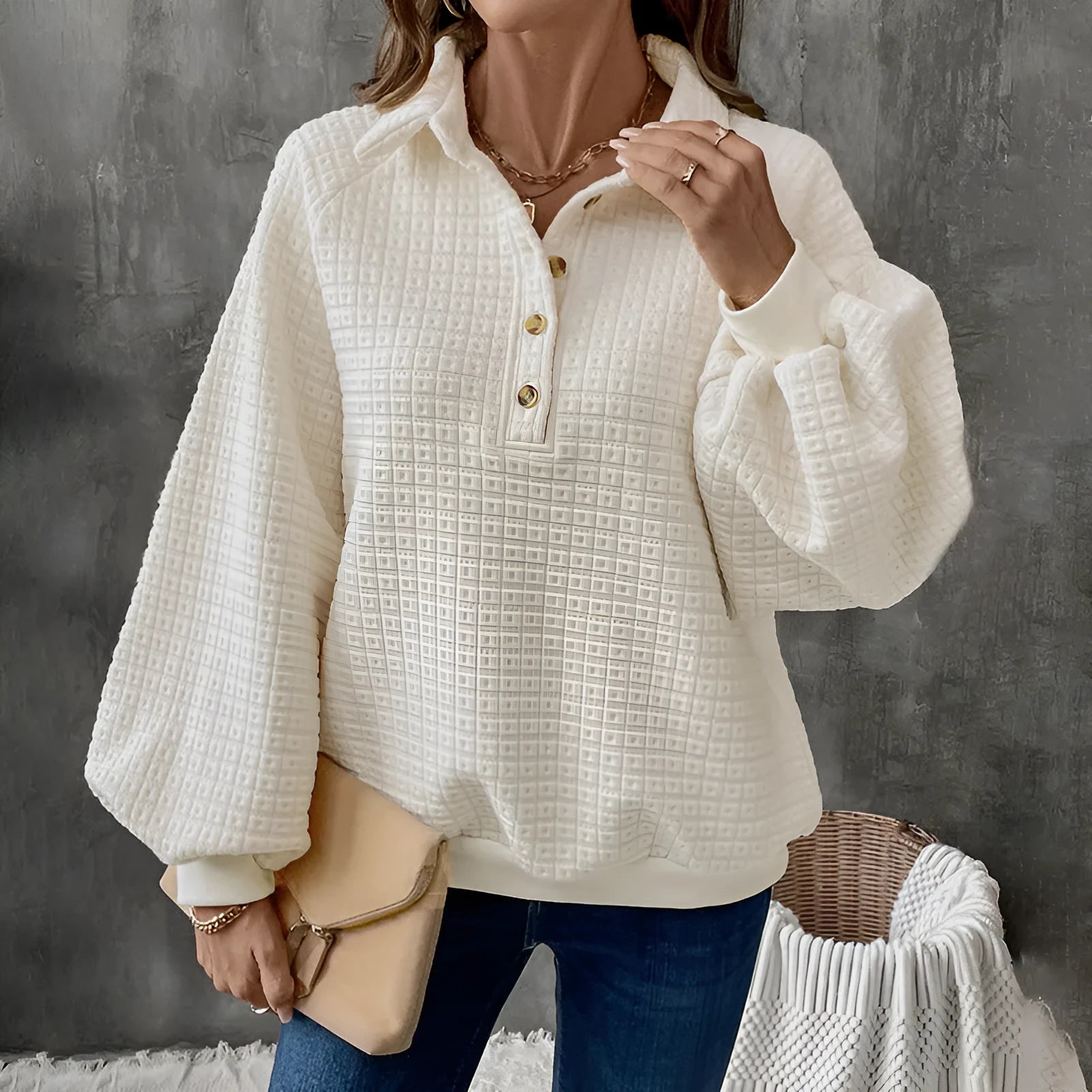 Women's textured polo collar solid colour sweater in beige on a hanger.