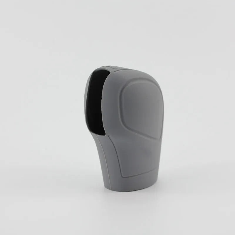 Universal silicone gear wave sleeve for automatic car gear stick, black colour, close-up on gear lever