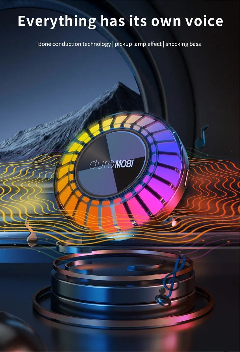 Black portable wireless Bluetooth subwoofer with 72-colour breathing rhythm lighting on a desktop