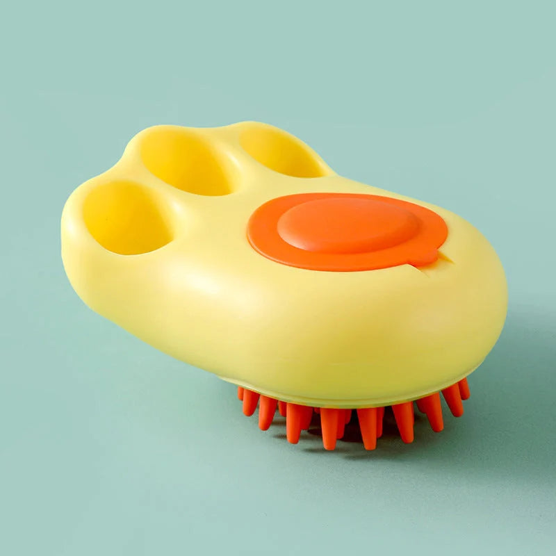 Claw-shaped pet grooming brush in pink, blue, yellow, and grey for cats and dogs