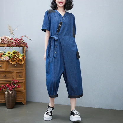 Women's Drawstring Denim Jumpsuit in blue and black with wide legs and cropped length