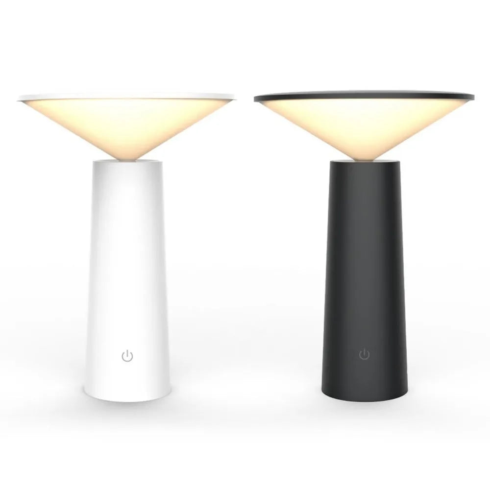 Black USB LED table lamp with touch controls and adjustable lamp head on wooden desk