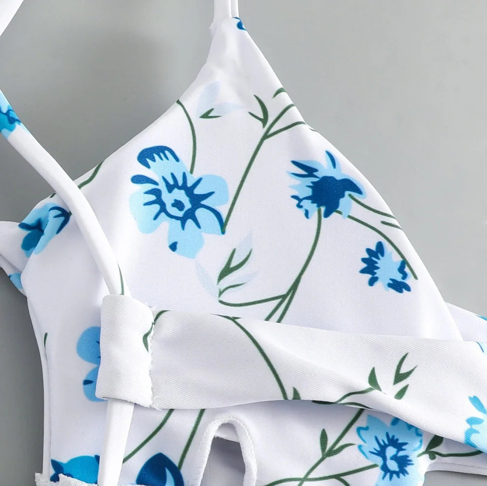 Women's floral pattern tie-neck triangle swimsuit with matching shorts on mannequin