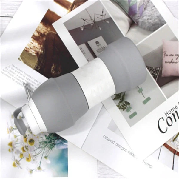 Collapsible silicone water bottle in various colours, showing folded and unfolded states