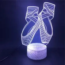 3D ballet dancer silhouette night light on a base with remote control, showing multiple colour options.