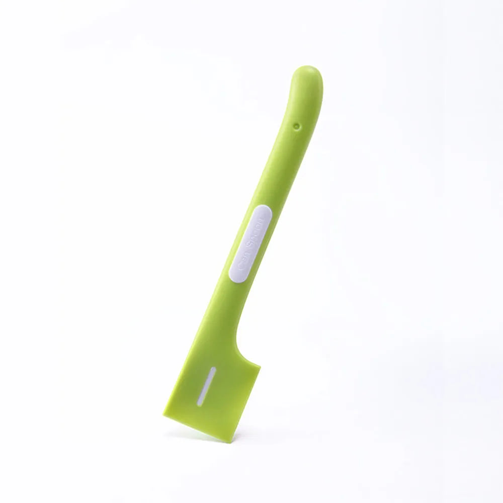 Green TPR pet feeding spoon with a long 16cm handle and right-angle scoop for canned wet food.