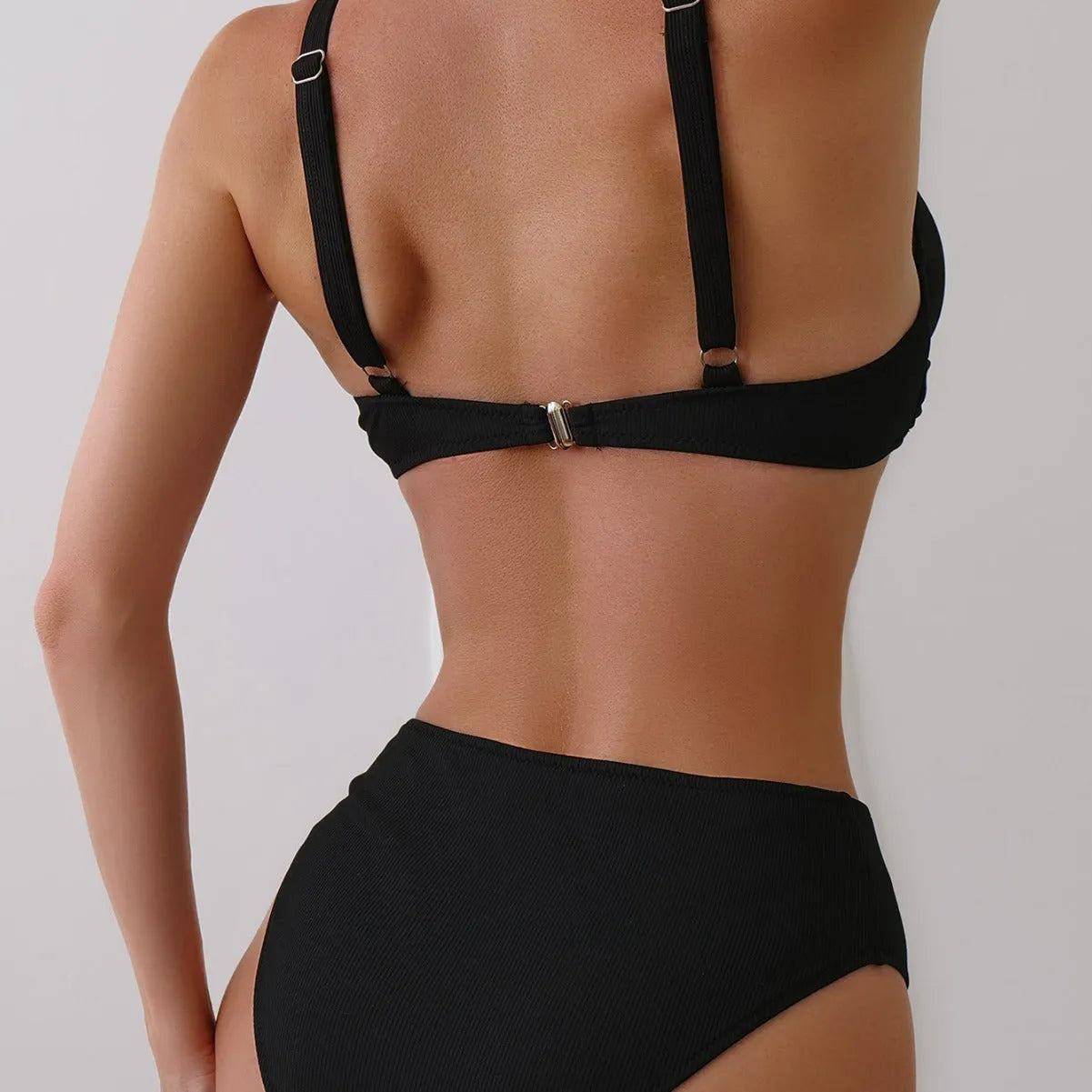 Women's solid colour rib fabric two-piece bikini set on a hanger.