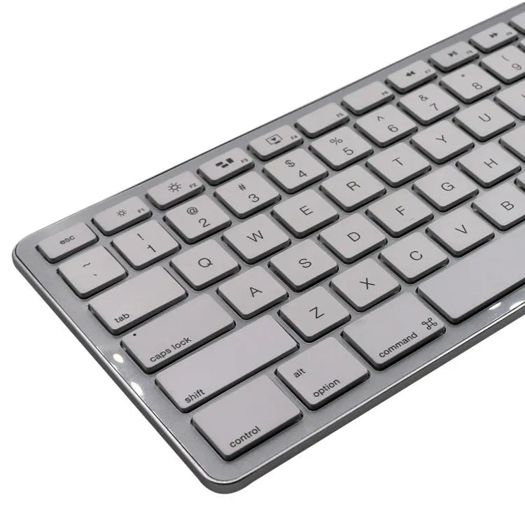 White wireless Bluetooth keyboard with 109 keys, shown on a desk.