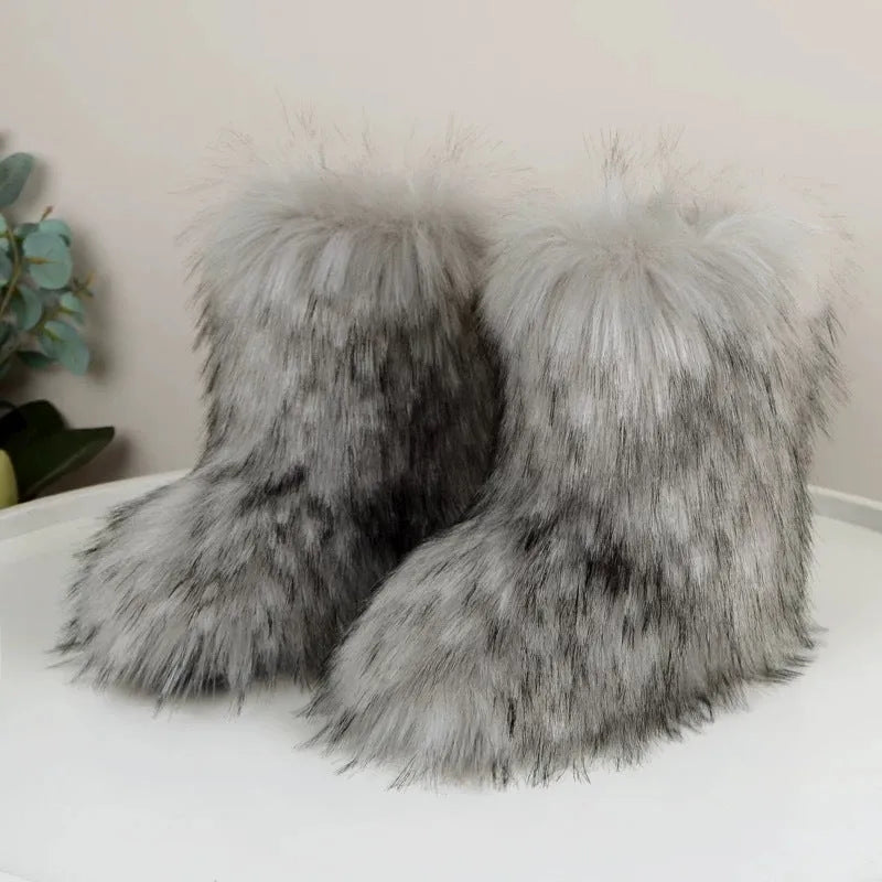 Women's imitation raccoon fur mid-calf boots with flat heel on a neutral background
