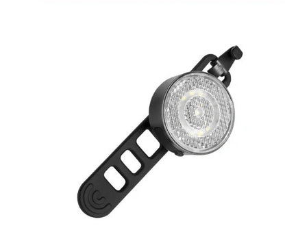 Bicycle LED headlight with clip attachment showing lens reflectors and USB port for charging