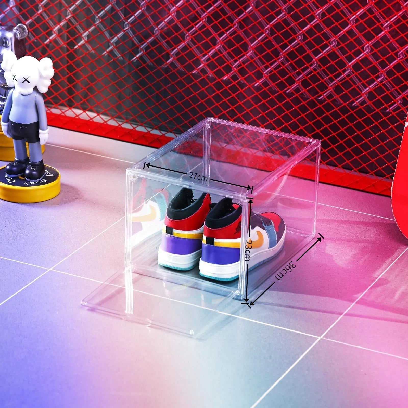 Transparent acrylic shoe storage box with magnetic side door showing shoe inside