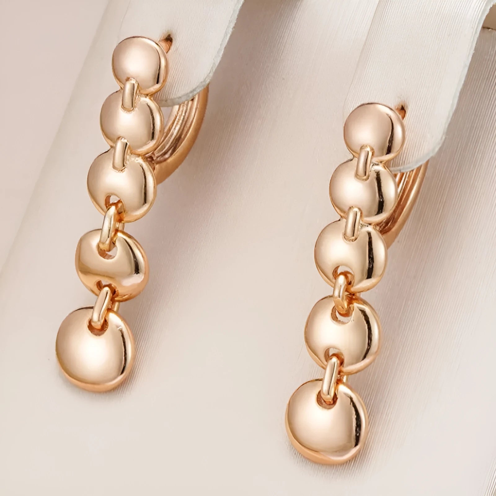 Gold tone retro long circle earrings with woven texture on a copper base.