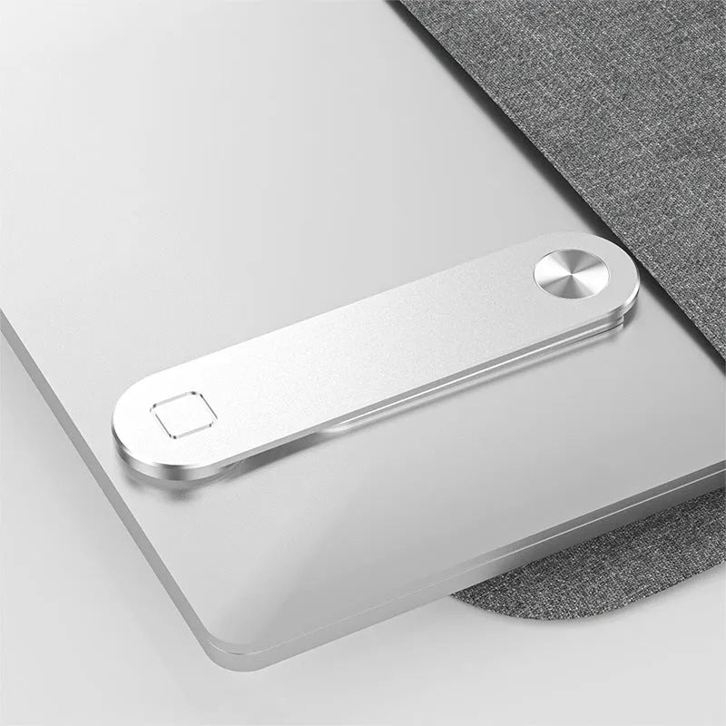 Black aluminium laptop phone holder mounted beside laptop screen showing dual-screen setup