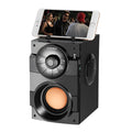 Black portable mini audio system with subwoofer and 3.5mm connection cable