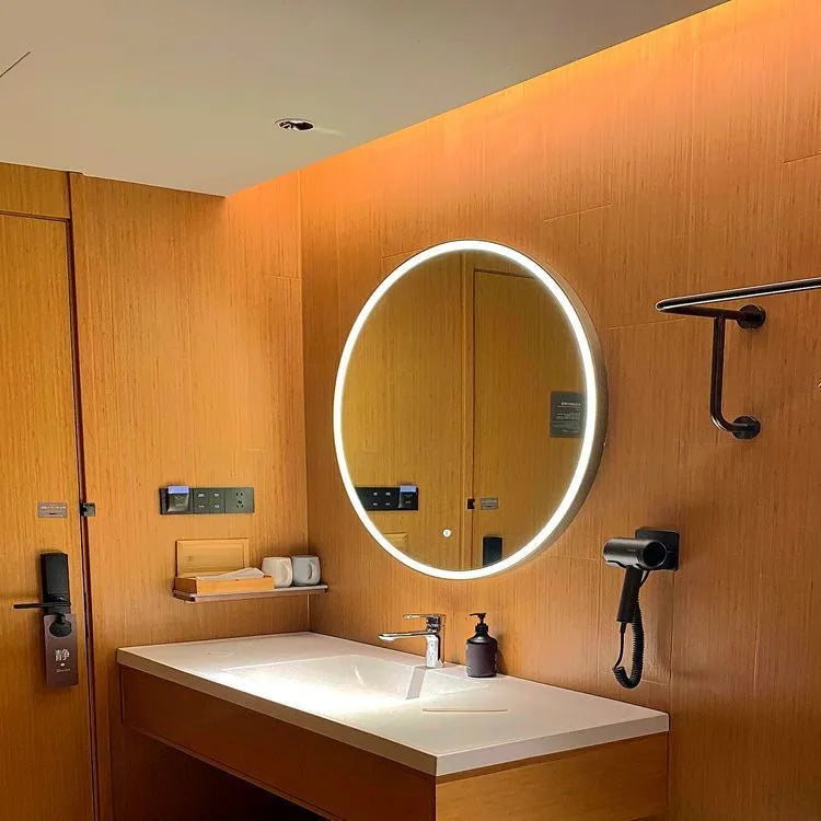 Round smart bathroom mirror with black aluminium frame and LED lighting