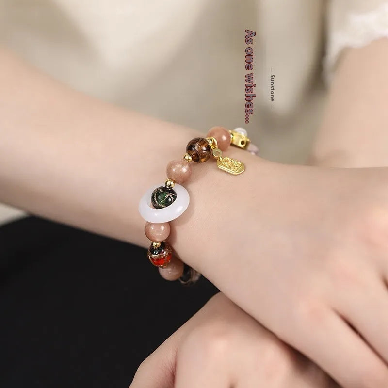 Hand-woven bracelet with fragrant grey coloured glaze, sunstone beads and white lip shell beads