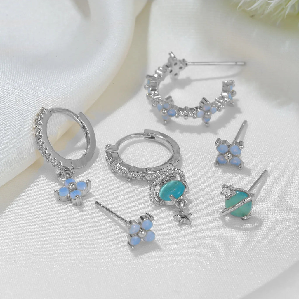 Gold and silver flower stud earrings with blue protein flower nail and zircon mosaic design.