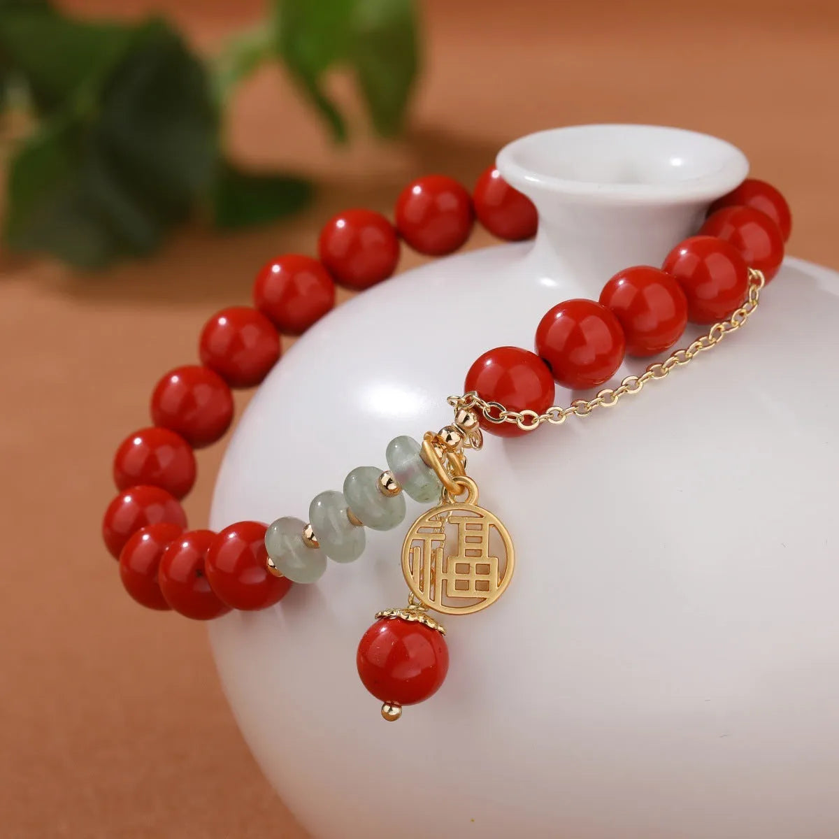Women's retro bracelet with red sand cinnabar, jade spacer beads, and fu character charm