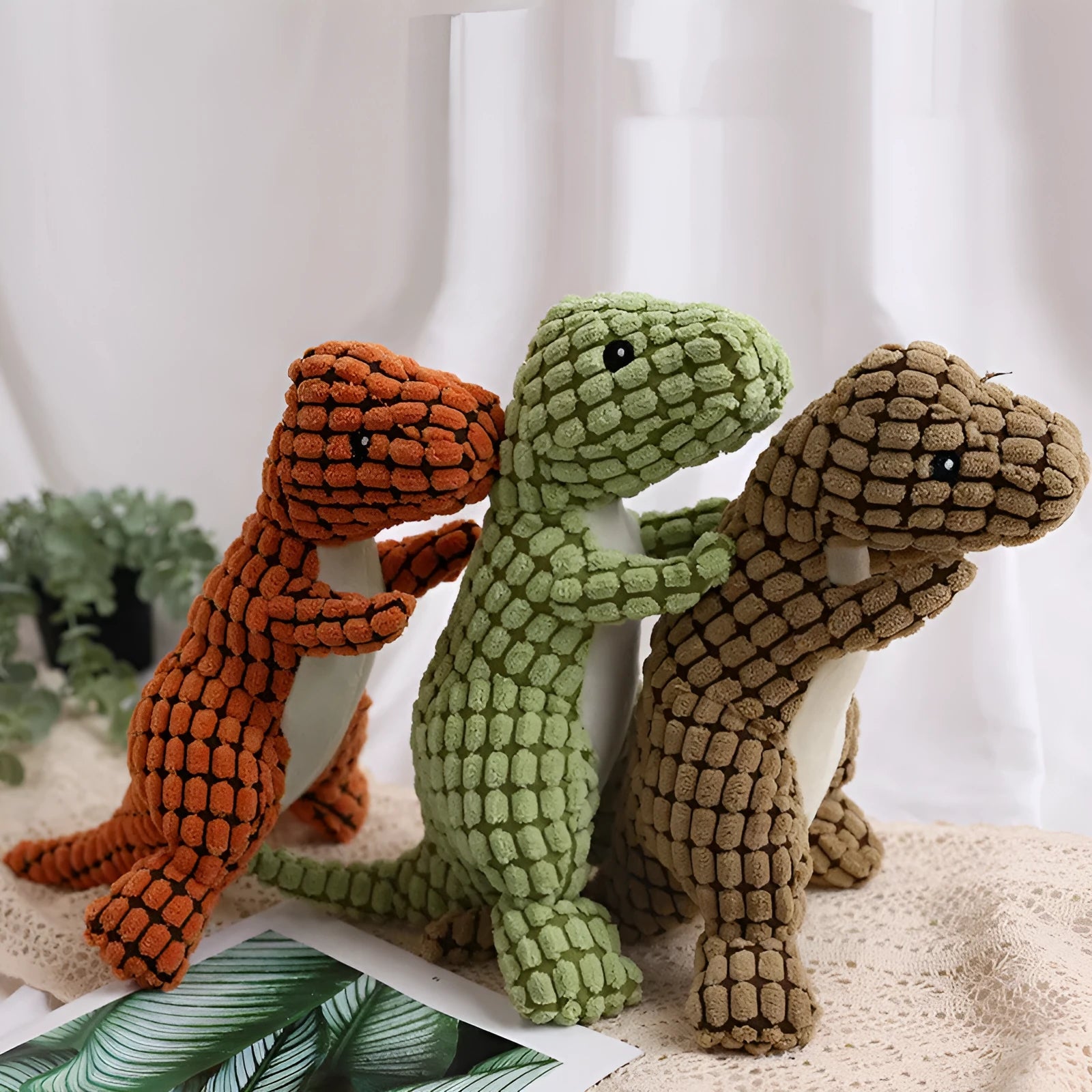 Dog bite resistant plush sounding toy dinosaur in corn wool, orange colour, 29x14cm