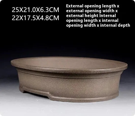 Handmade antique oval purple sand clay bonsai pot showing shallow 25cm length and 21cm width.