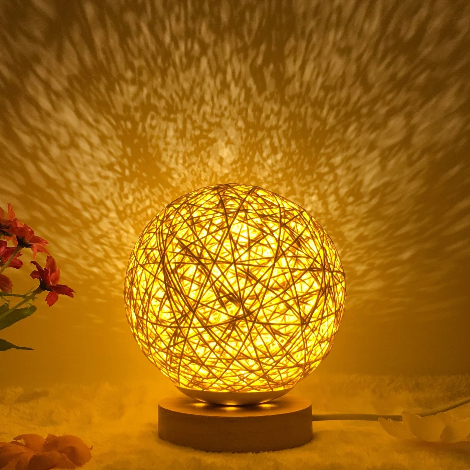 LED rattan table lamp with hand-knit lampshade in various colours