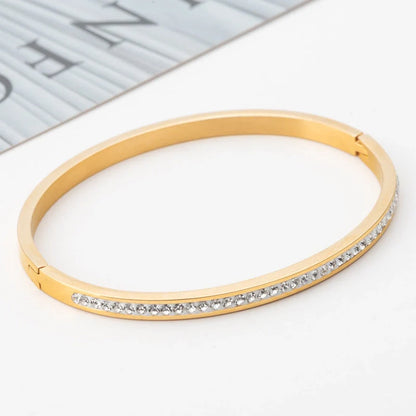 Single row stainless steel bracelet with diamond opening in gold, rose gold, or steel