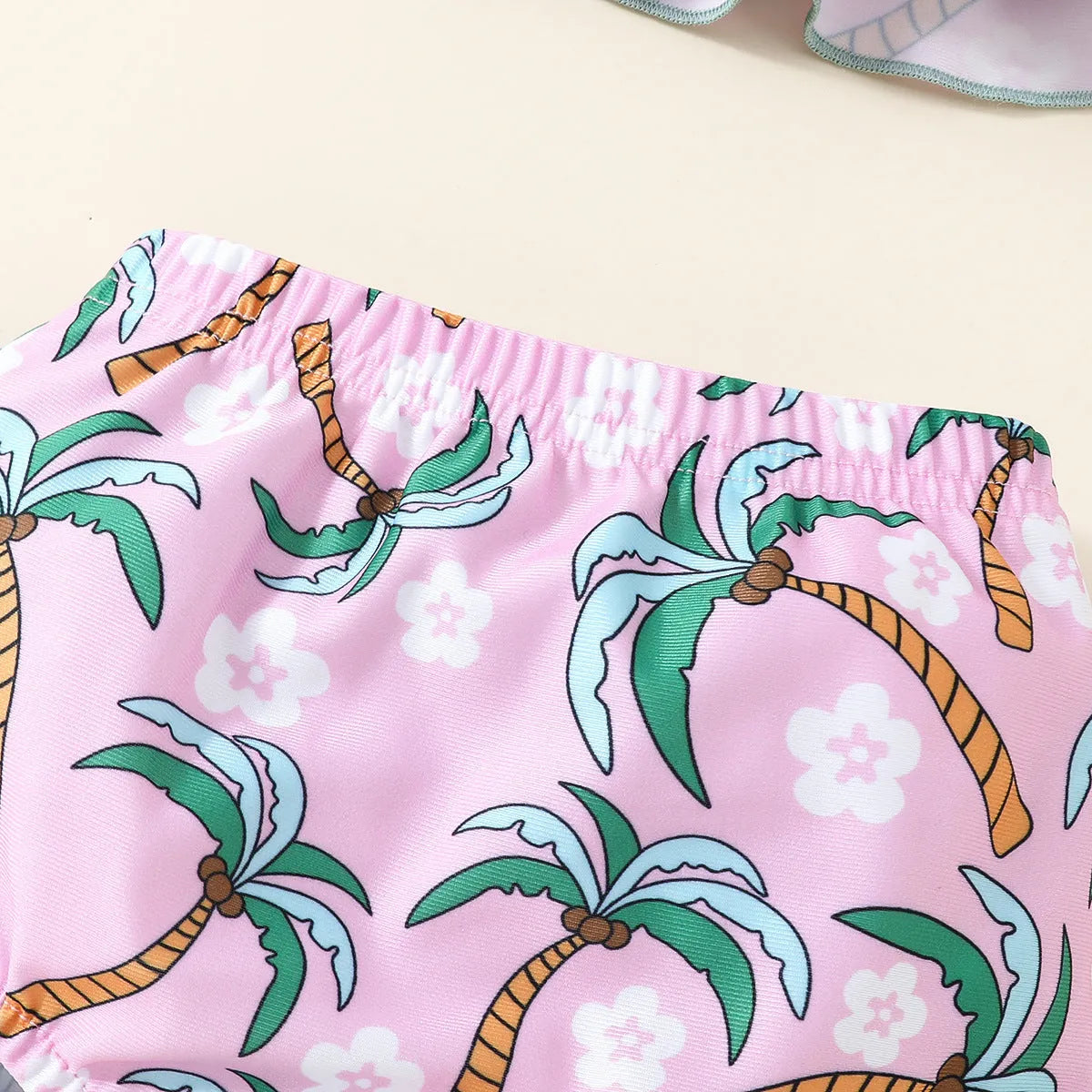 White polyester two-piece swimsuit set for girls with shirt top and shorts.