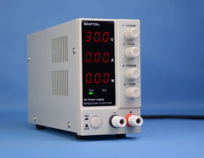 White NPS605W adjustable DC bench power supply with voltage and current dials for electronics repair.