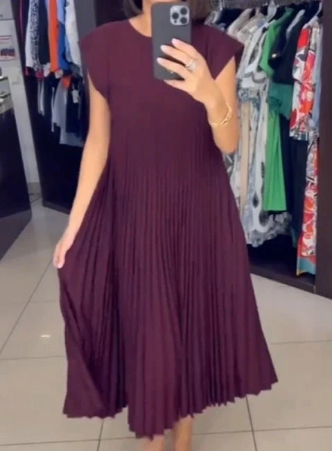 Women's summer pleated long dress in various colours, showcasing the unique design and flattering silhouette.