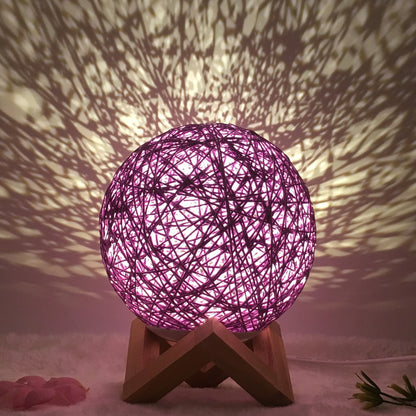 LED rattan table lamp with hand-knit lampshade in various colours
