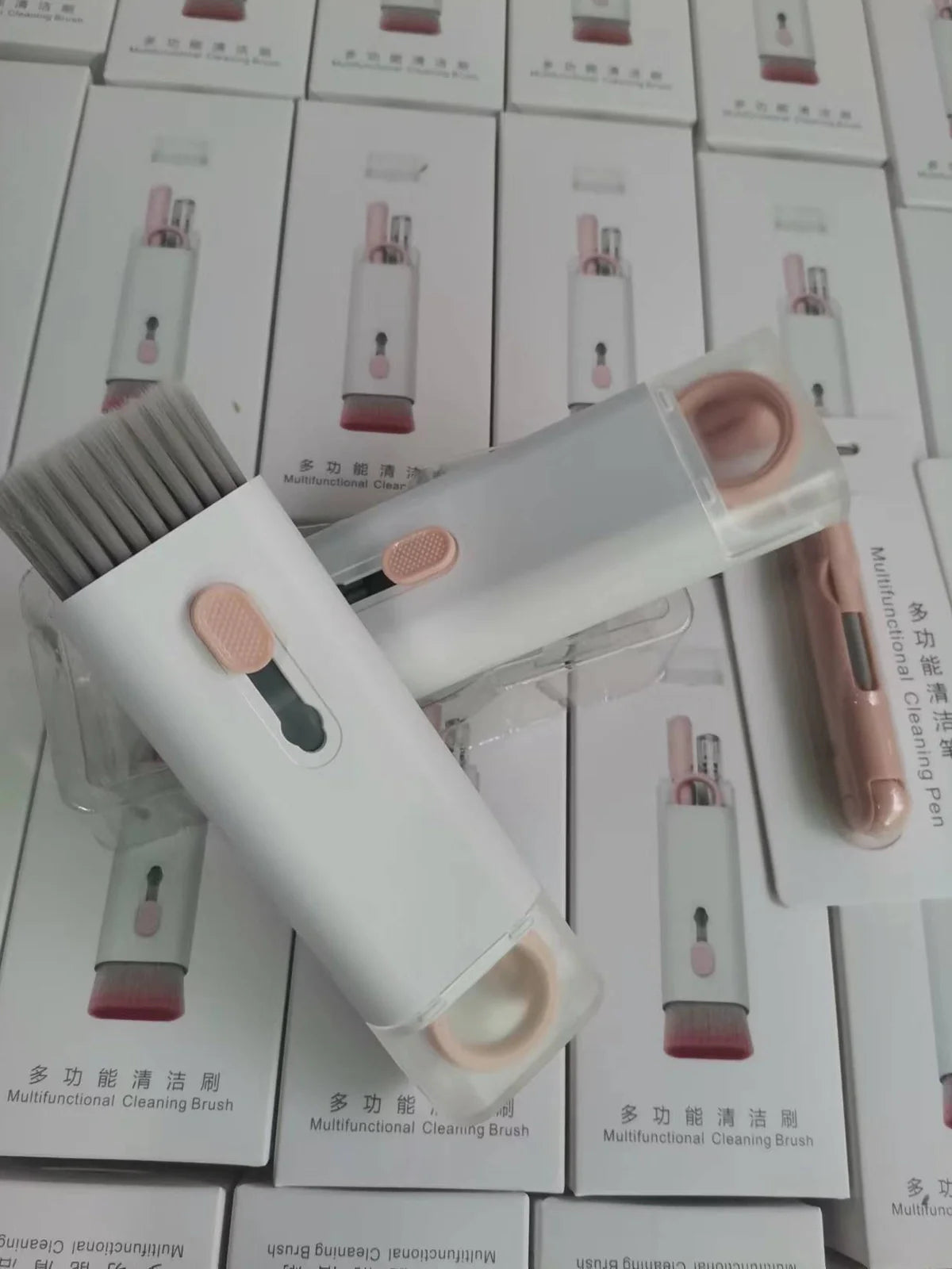 Pink and blue computer cleaning pen set with brush, keycap tool, and empty spray bottle