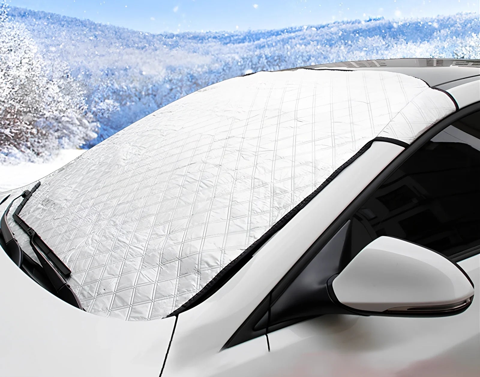 Silver magnetic windshield cover showing aluminium foil coating and edge magnets for vehicle protection