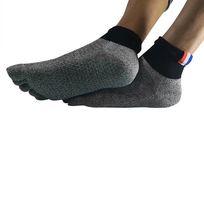 Grey five-toe cut-resistant anti-slip beach socks with non-slip silica gel sole against a neutral background