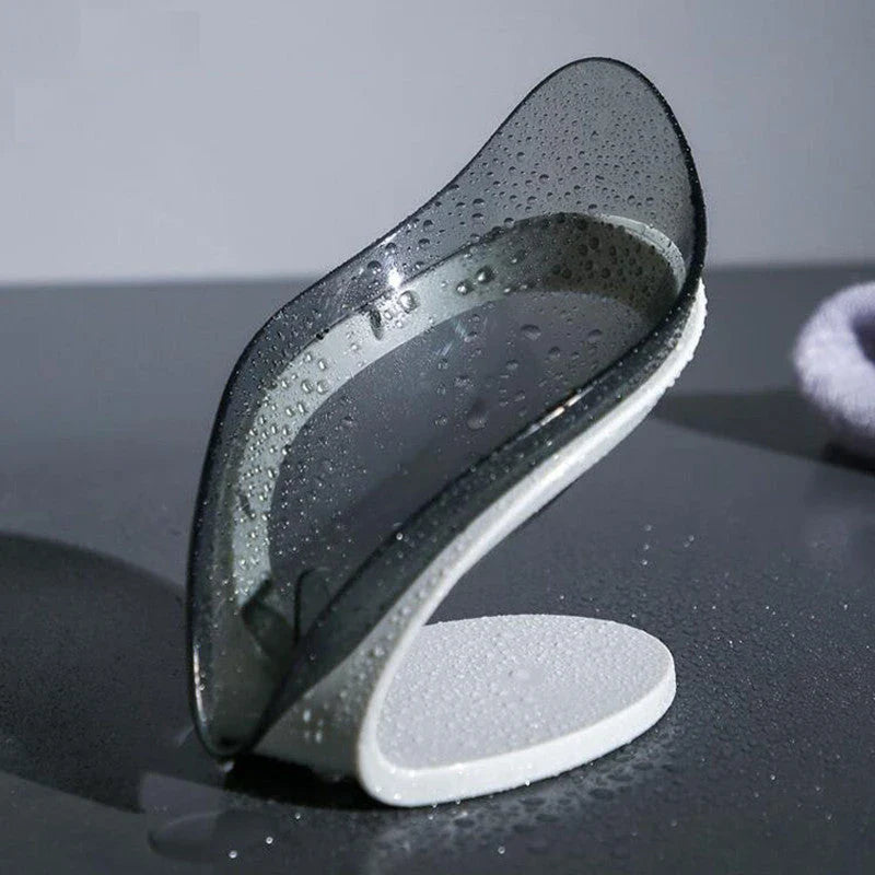 Self-draining leaf-shaped soap dish made of durable ABS material, featuring a unique triangle structure to prevent soap from slipping