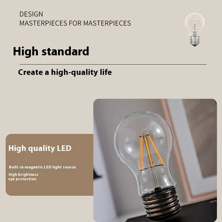 Modern suspension bulb desk night lamp with iron art construction and black wood grain base.